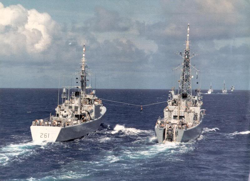HMCS MACKENZIE (left) conducts a jack-stay personnel transfer with Canadian Improved Restigouche Class Destroyer.